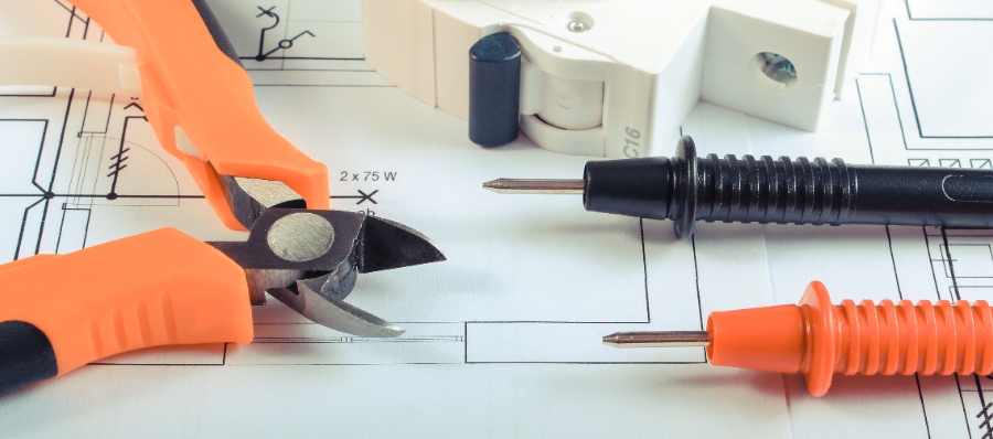 Schéma clair illustrant le branchement d’un télérupteur Merlin Gerin Multi 9 TL avec ses bornes repérées